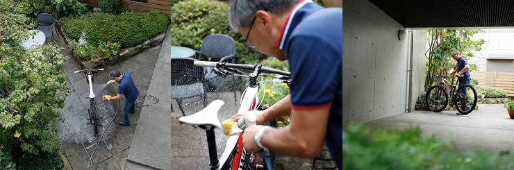 ご自宅の庭で愛車のマウンテンバイクを洗う。